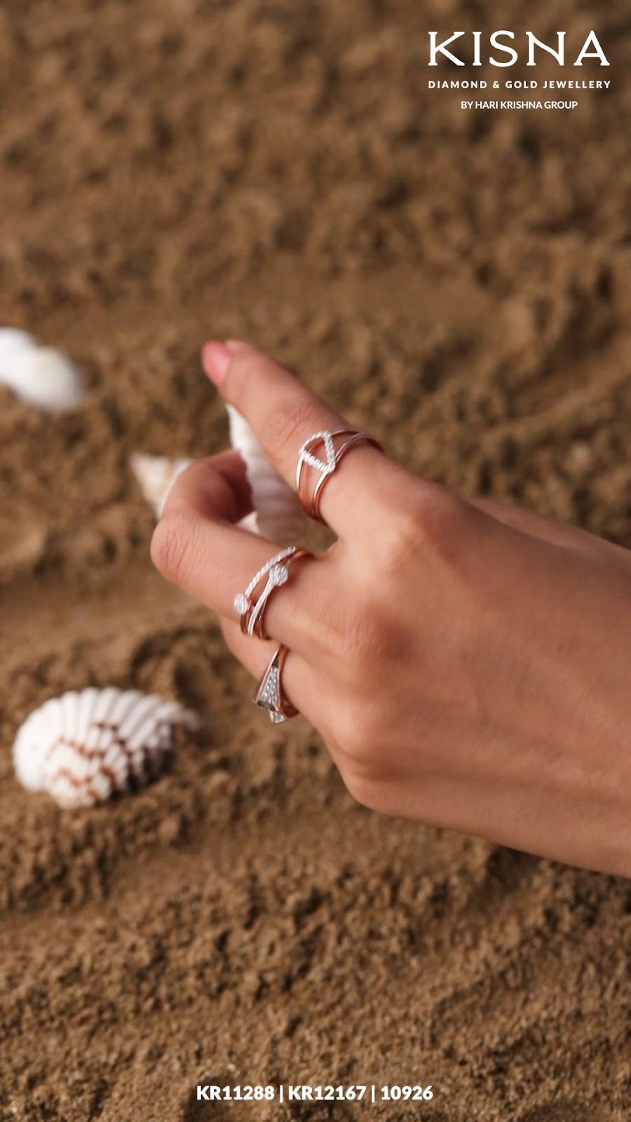 Hand wearing KISNA diamond and gold rings available at newMATRI JEWELLERY